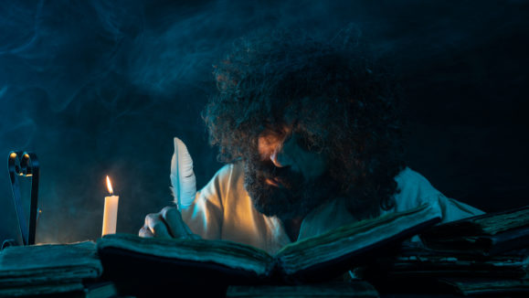 Portrait Of Mature Adult Man Writing With Quills Pen