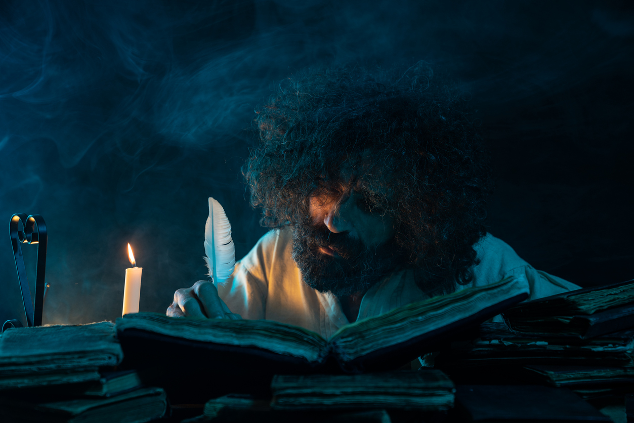 Portrait Of Mature Adult Man Writing With Quills Pen