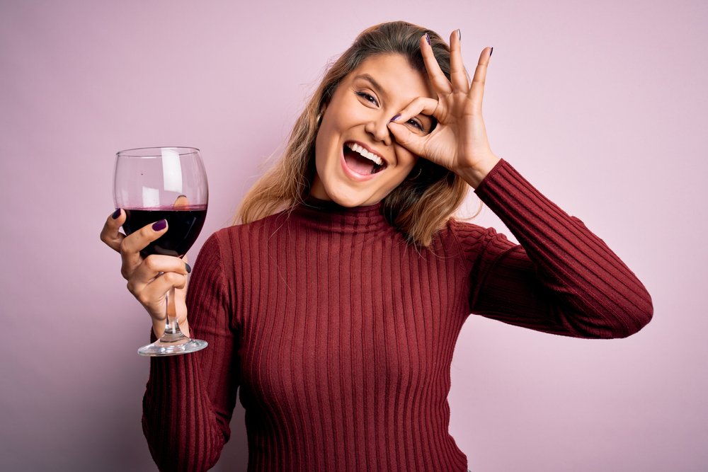 Young,Beautiful,Blonde,Woman,Drinking,Glasse,Of,Red,Wine,Over